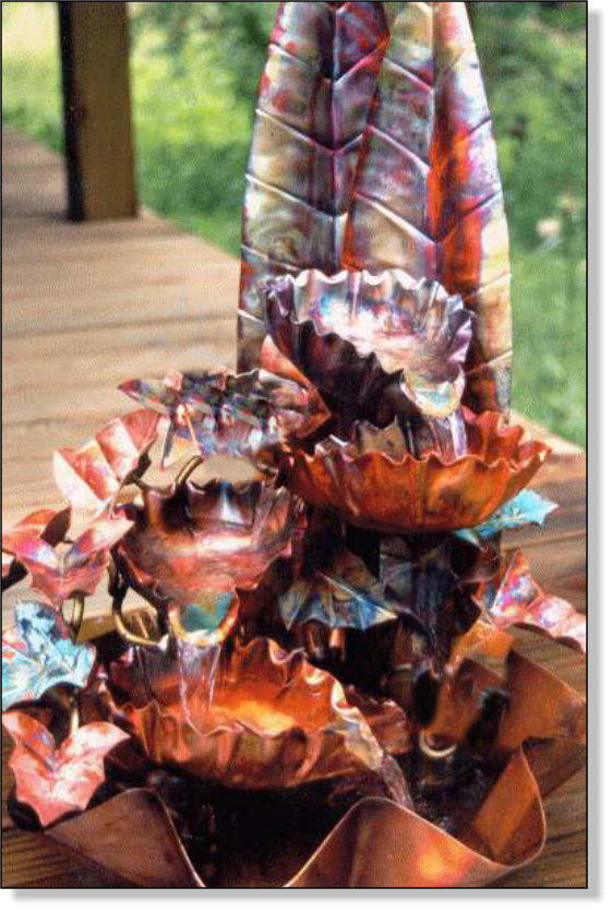 Four bowl copper fountain with large back leaves