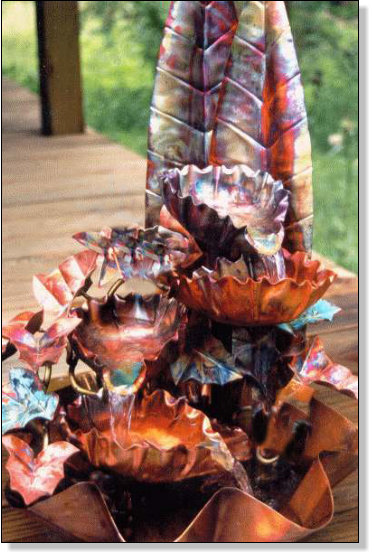 Four bowl copper fountain with large back leaves