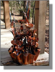 Large eight tiered copper fountain with irises